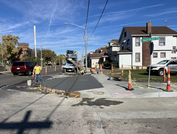 Construction crew working on bump-out, one of many safety features added to Dayton’s North Main St.